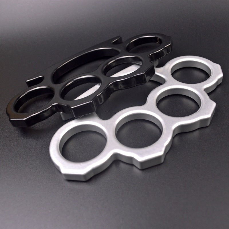 Black and silver knuckle dusters displayed together