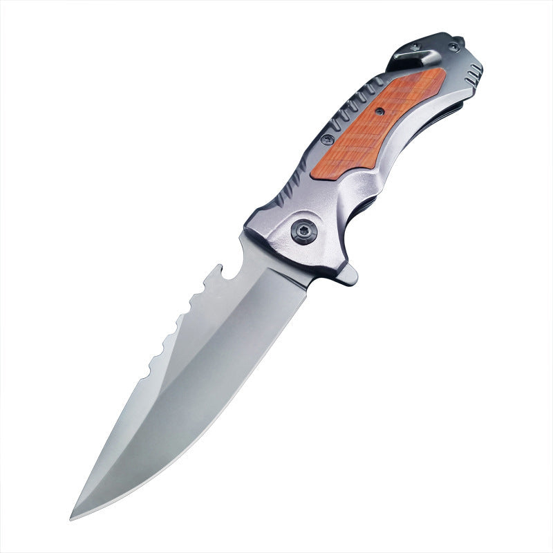 Multifunctional folding knife open on a clean white background