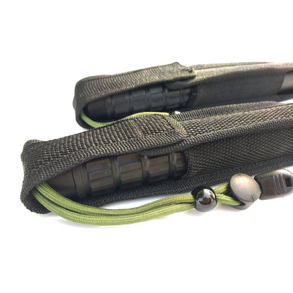 Close-up of the black nylon pouch with the green cord and bead toggle outside