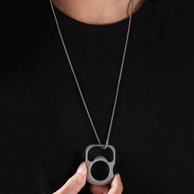 Opener tool threaded on a chain and worn as a pendant over a black shirt