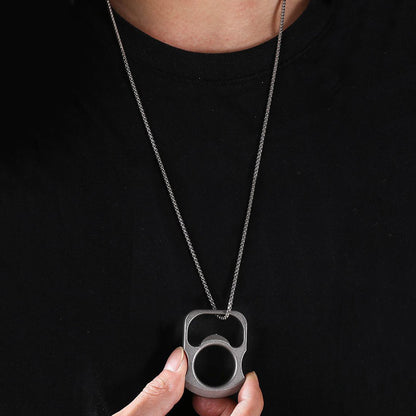 Opener tool threaded on a chain and worn as a pendant over a black shirt