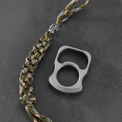 Hands prying a red crown cap from a green bottle with the zinc alloy opener ring tool