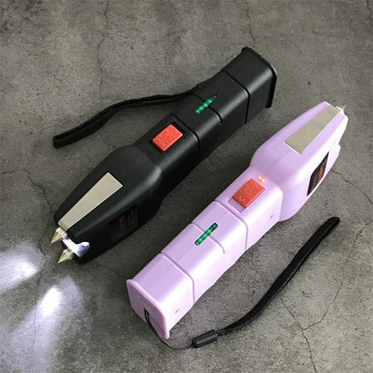 Black and light purple units at an angle with the black LED beam pooling on concrete, green indicator light and chrome head plates