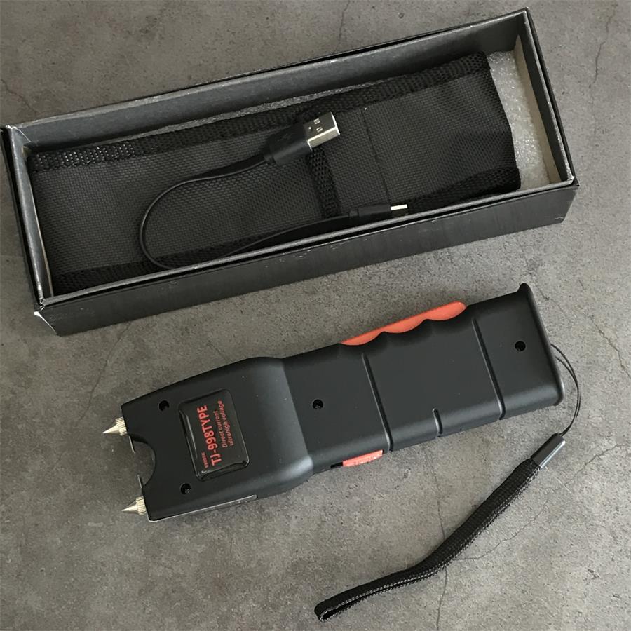 Black retail box with nylon holster and USB cable beside the black 998 unit showing its TJ-998TYPE label and orange grip