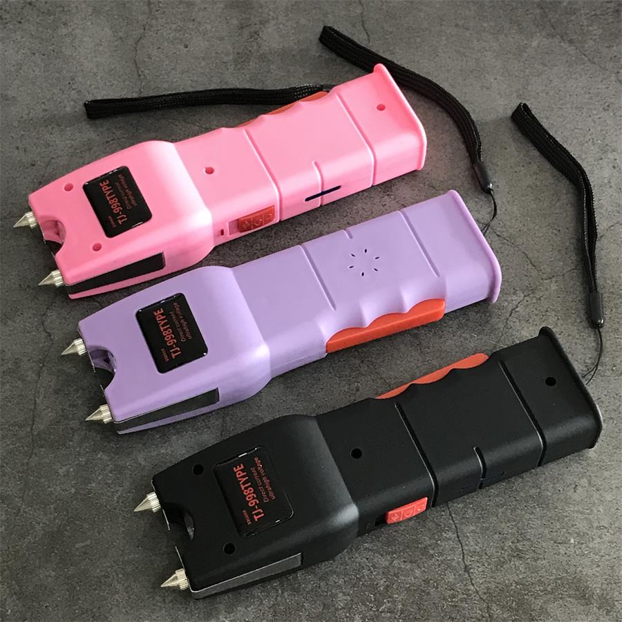 Three 998 units in pink, purple and black showing the scalloped orange grip inserts and dotted speaker perforations on the backs