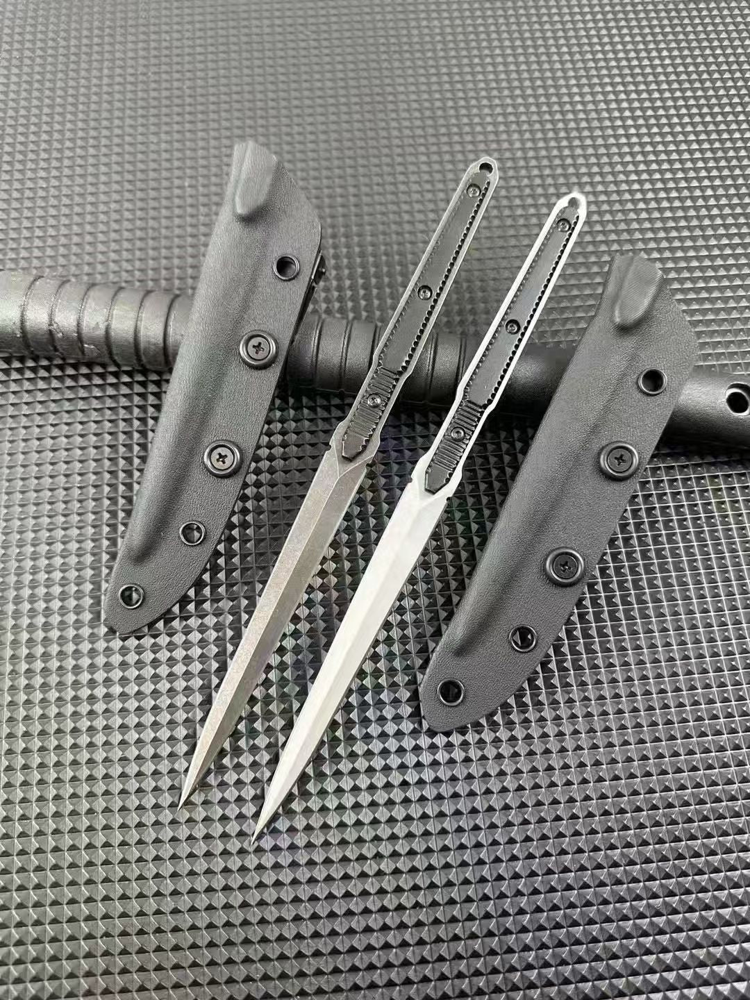 Two bayonets with dark and light blades flanked by two black sheaths