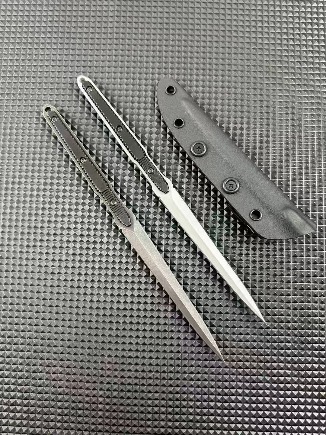 Single bayonet held in a black glove with sheath behind