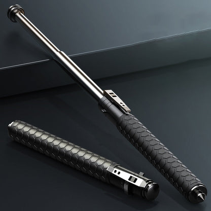 Extended and closed pen-shaped batons with hexagon-textured black handles and a steel tip on a dark blue-grey surface