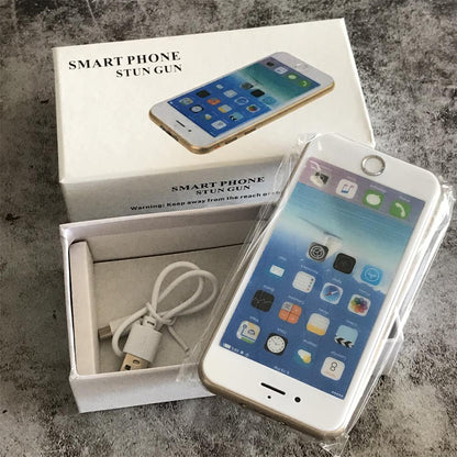 White retail box printed with Smart Phone Stun Gun alongside the plastic-wrapped device and a white USB charging cable in the open tray