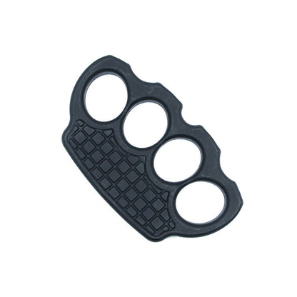 Black polymer knuckle duster lying flat on a white background with the grid palm panel visible