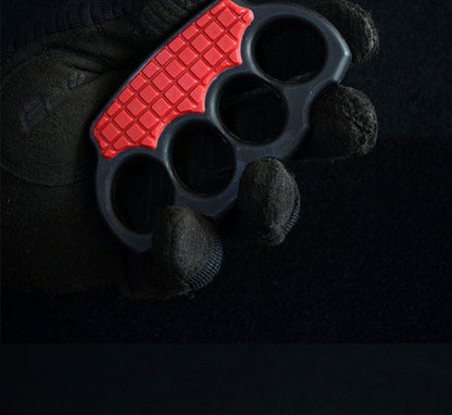Brown-black knuckle duster with a tan body and black grid palm panel on a white background