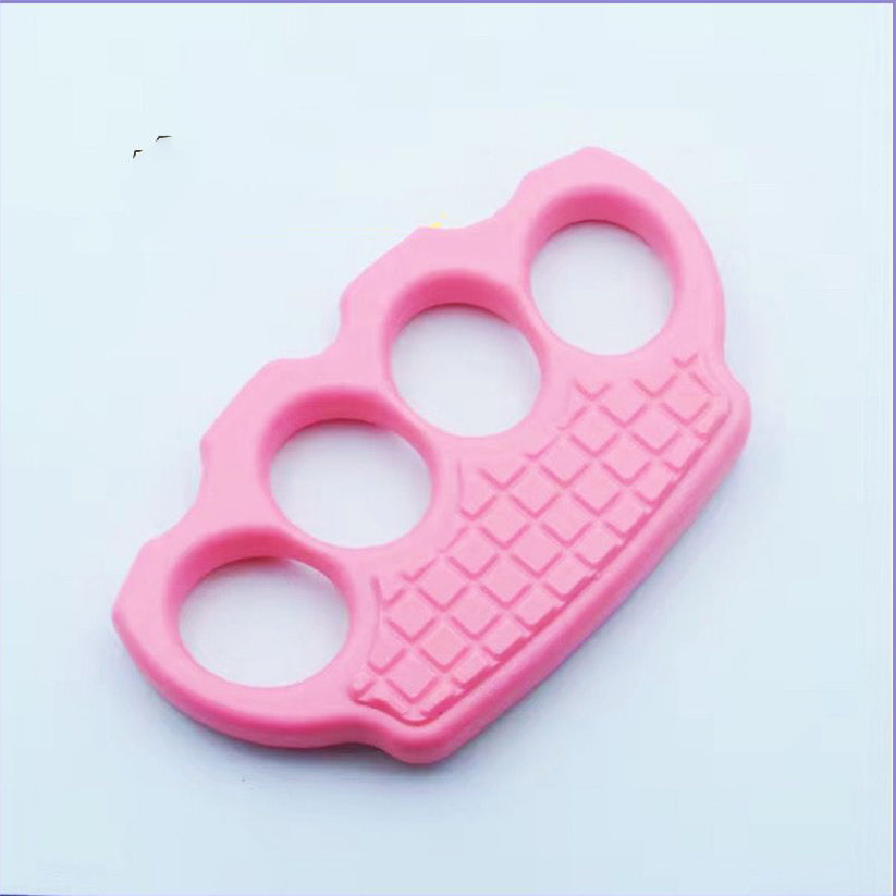 Pink polymer knuckle duster with a matching pink grid panel on a light background