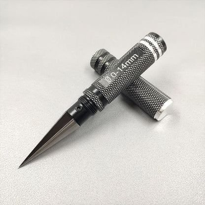 Tapered hole expander resting diagonally on a light gray surface with the aperture marking visible on the handle.