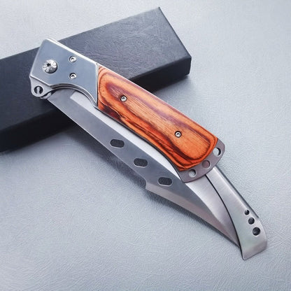 Large folding knife fully closed showing redwood handle scales on black box
