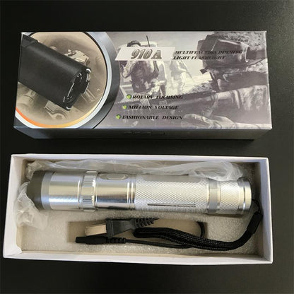 Silver 910A unit plastic-wrapped in the white inner tray with the wall charger and wrist strap below the printed box lid