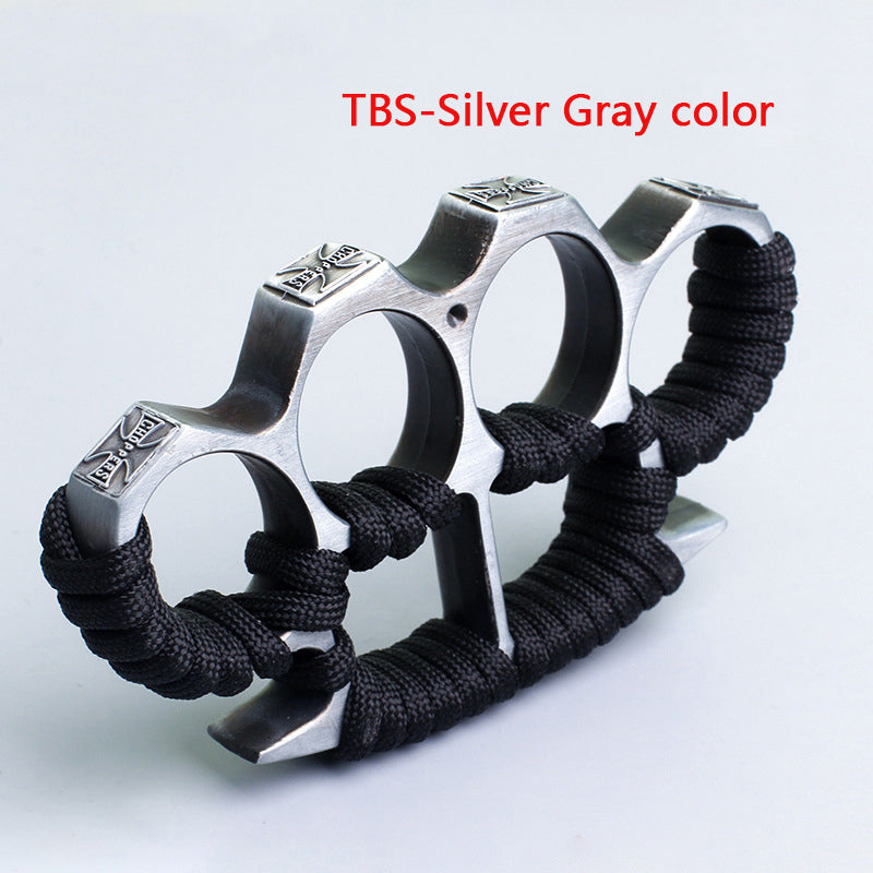 Silver gray three-hole knuckle duster with black paracord grip on white background