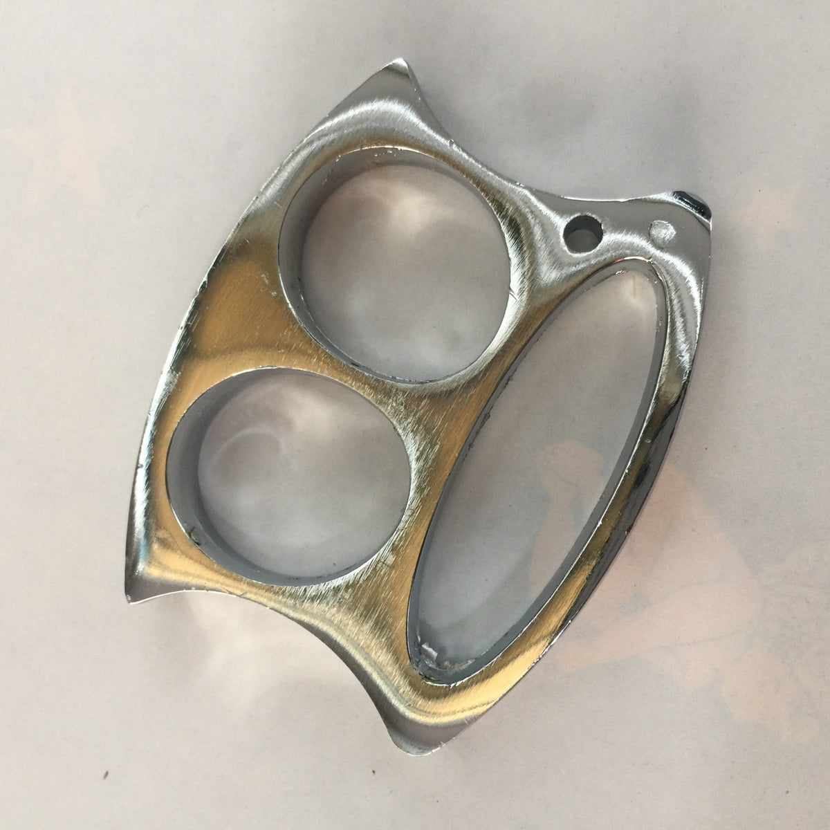 Top-down view of the Silver two-hole zinc alloy knuckle duster on a white background.