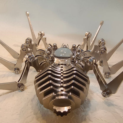 Front view of the spider sculpture showing stacked abdomen plates and a glossy dome head