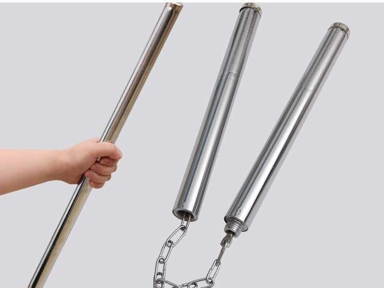 Hero shot with a hand holding a steel baton for scale beside the chain-linked baton halves, light gray studio background
