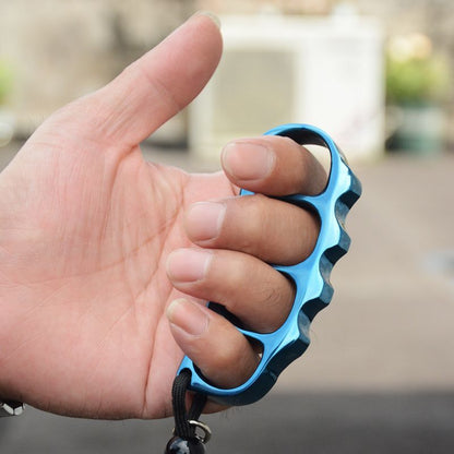 Blue finished steel knuckle worn on four fingers with a black paracord lanyard hanging below