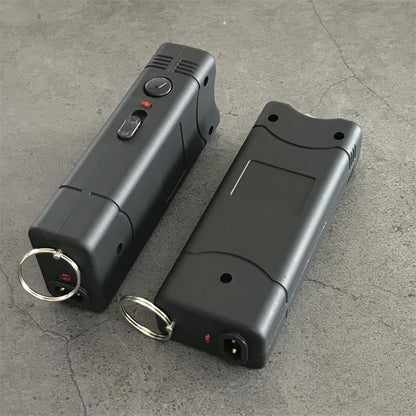 Black 801C stun guns shown from both sides with the control buttons, charging port and keyring visible
