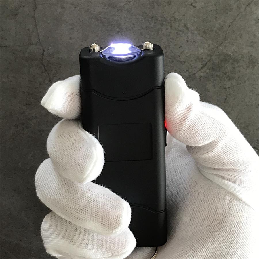 Black 801C stun guns seen from the rear showing the charging socket and attached keyrings