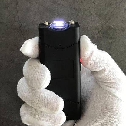 Black 801C stun guns seen from the rear showing the charging socket and attached keyrings