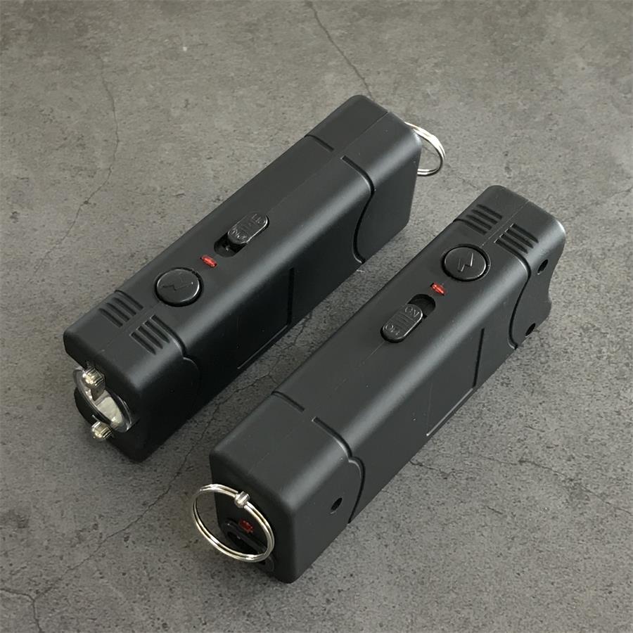 Black 801C stun guns viewed from the side showing the light lens, switches and keyrings