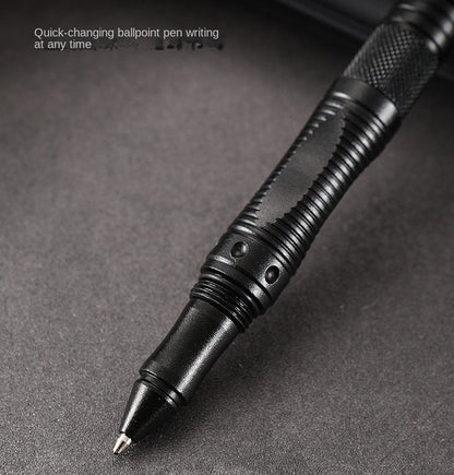Close-up of the black tactical pen's ballpoint tip with a knurled grip and a double-collar band above it, captioned Quick-changing ballpoint pen writing at any time.