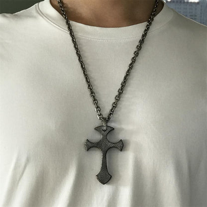 Person wearing TC21 titanium cross necklace with white t-shirt showing fit and scale