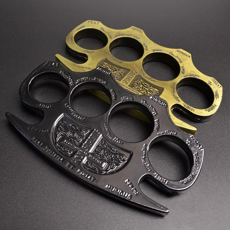 Black and golden knuckle dusters stacked together showing the same engraved shield design