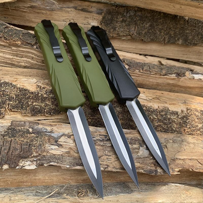 Three automatic OTF pocket knives showing pocket clips and handle backs on wood