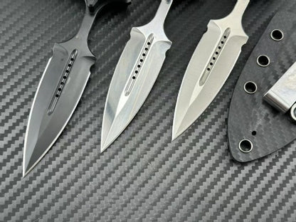 Detailed close-up of three push dagger blades with machined slots and carbon fiber sheath
