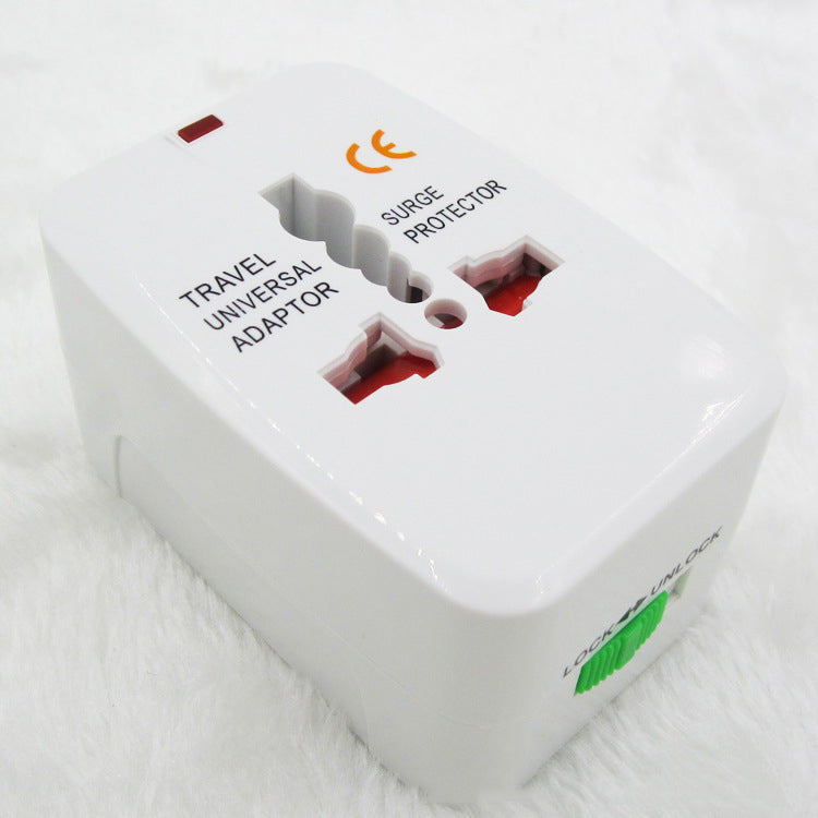 Travel adapter kit laid out with a blue international adaptor color box, a gray drawstring pouch, a folded instruction manual and the white universal plug
