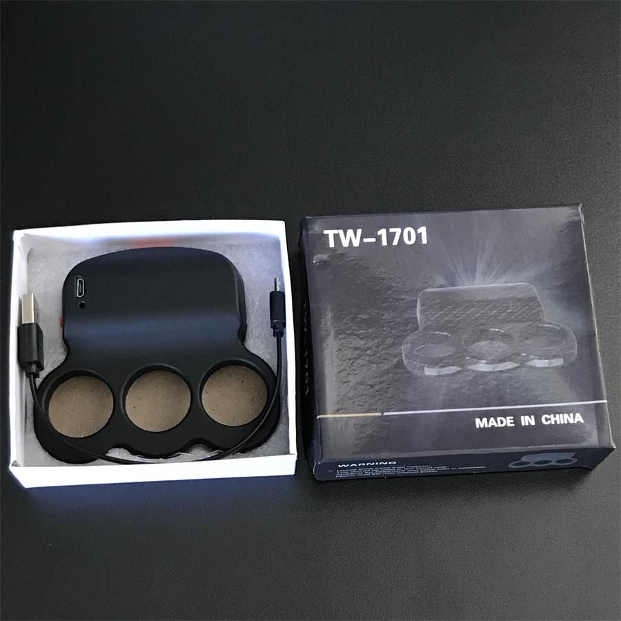 Black three-hole stun device with its USB charging cable inside an open white box, beside the black TW-1701 retail box with product print