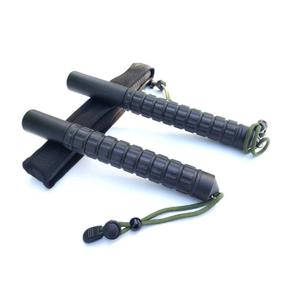 Two collapsed batons crossed over a black nylon pouch on a white background