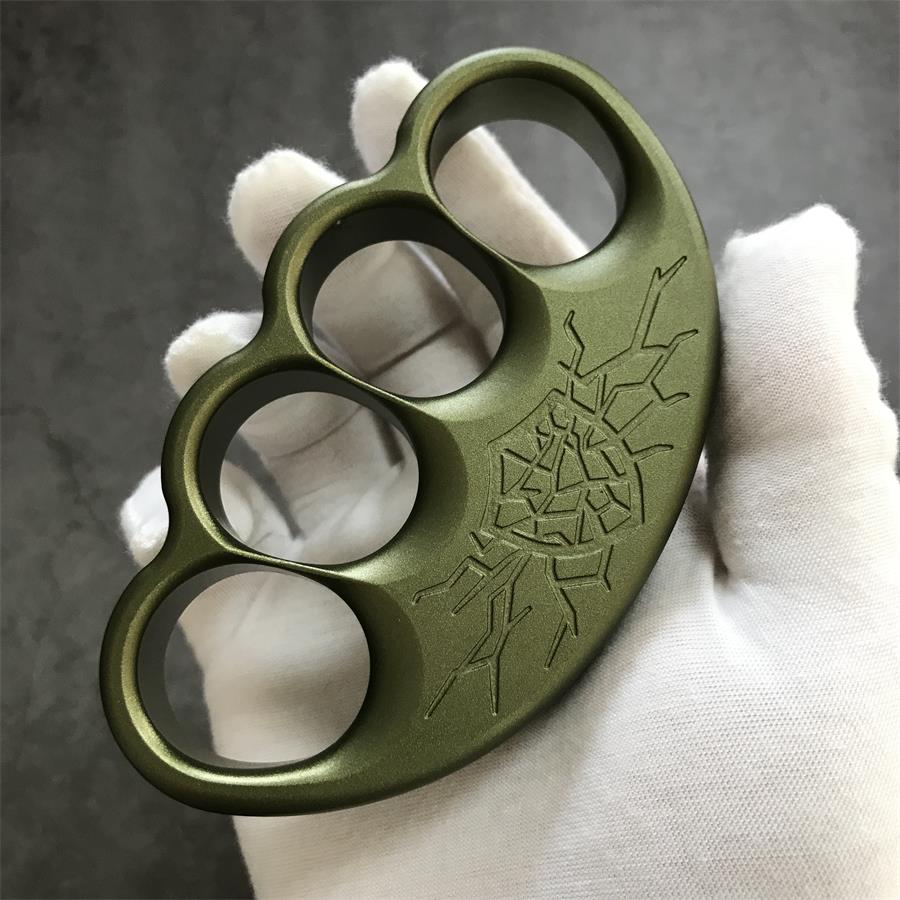 Two olive knuckle dusters stacked to show crest face and scalloped base