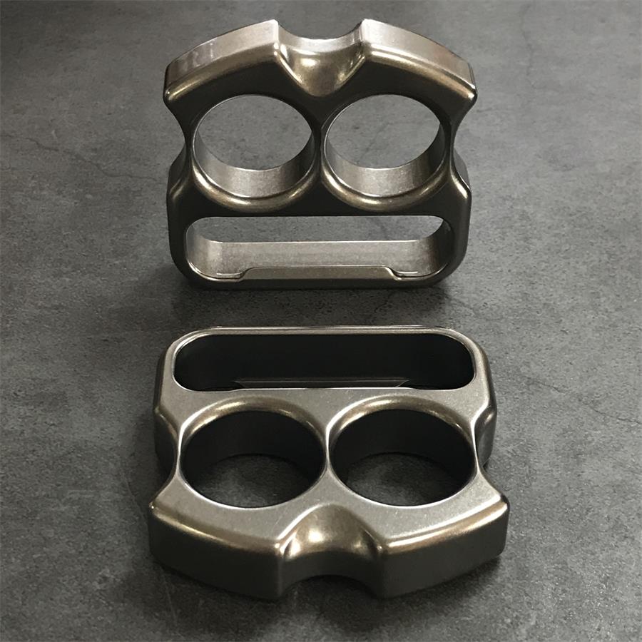 Titanium duster upright beside a second piece showing reverse face