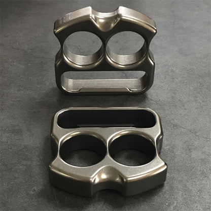 Titanium duster upright beside a second piece showing reverse face