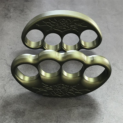 Knuckle duster worn across gloved fingers in closed hold