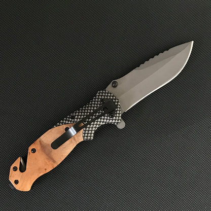 Back view of the open Liome X50 showing carbon fiber pattern scales, black pocket clip, wood front and rear scales and the sawback spine